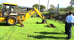 Deputy Premier of Nevis and Area Representative for the St. John’s Parish Hon. Mark Brantley and Permanent Secretary in the Ministry of Social Development Keith Glasgow witness the groundbreaking for a project to enhance the Brown Hill play field on November 18, 2014
